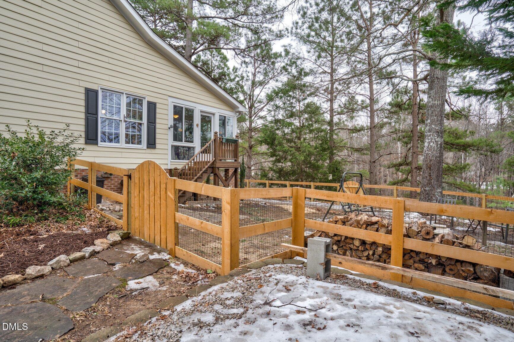 259 Sacred Fire Road Louisburg, NC 27549 - Photo 33 of 35 a view of a chairs and table in the backyard