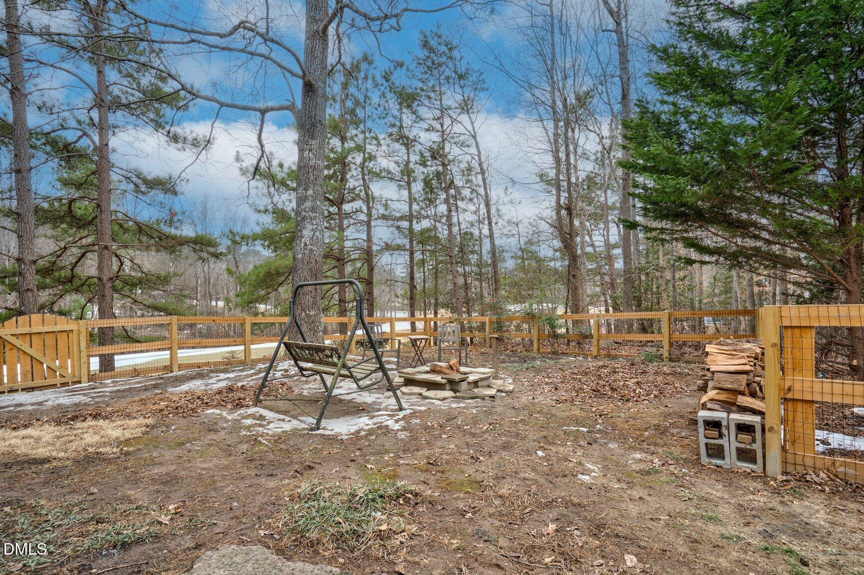 259 Sacred Fire Road Louisburg, NC 27549 - Photo 34 of 35 a view of a park with swings and slides