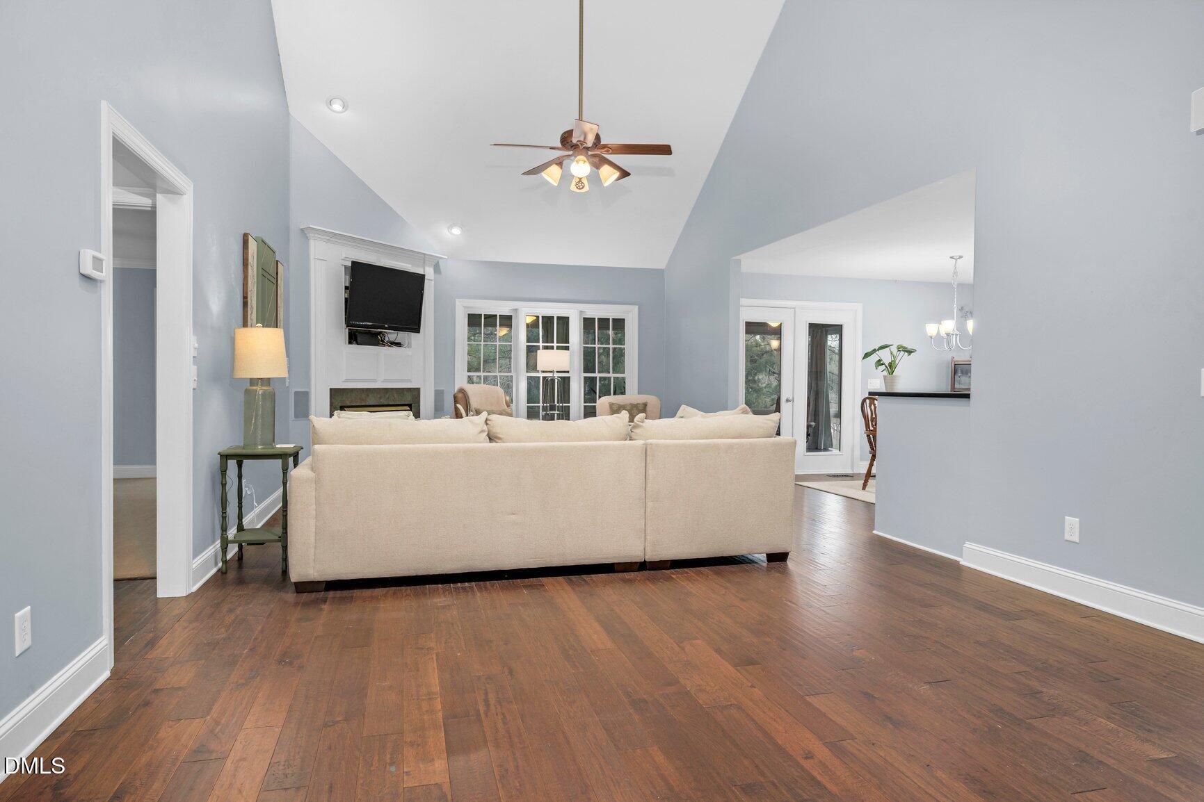 259 Sacred Fire Road Louisburg, NC 27549 - Photo 4 of 35 a living room with furniture and a flat screen tv