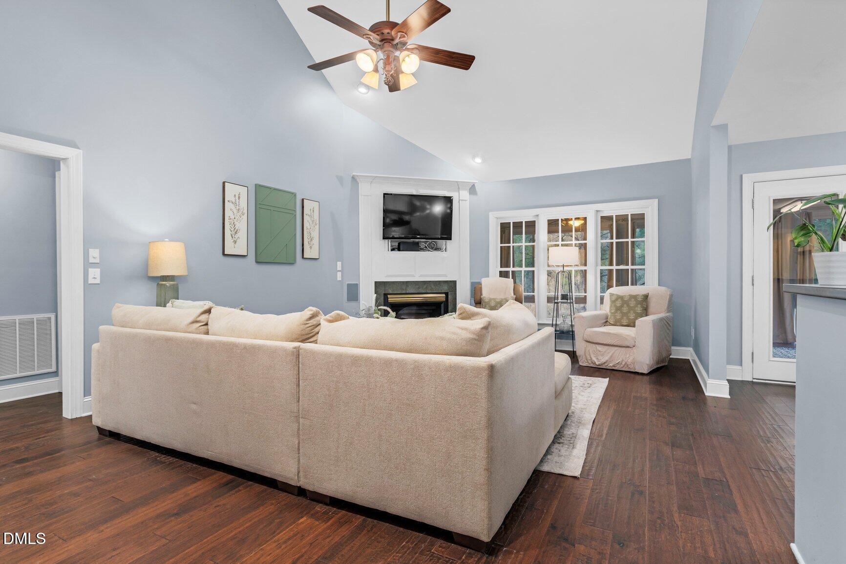 259 Sacred Fire Road Louisburg, NC 27549 - Photo 5 of 35 a living room with furniture and a wooden floor
