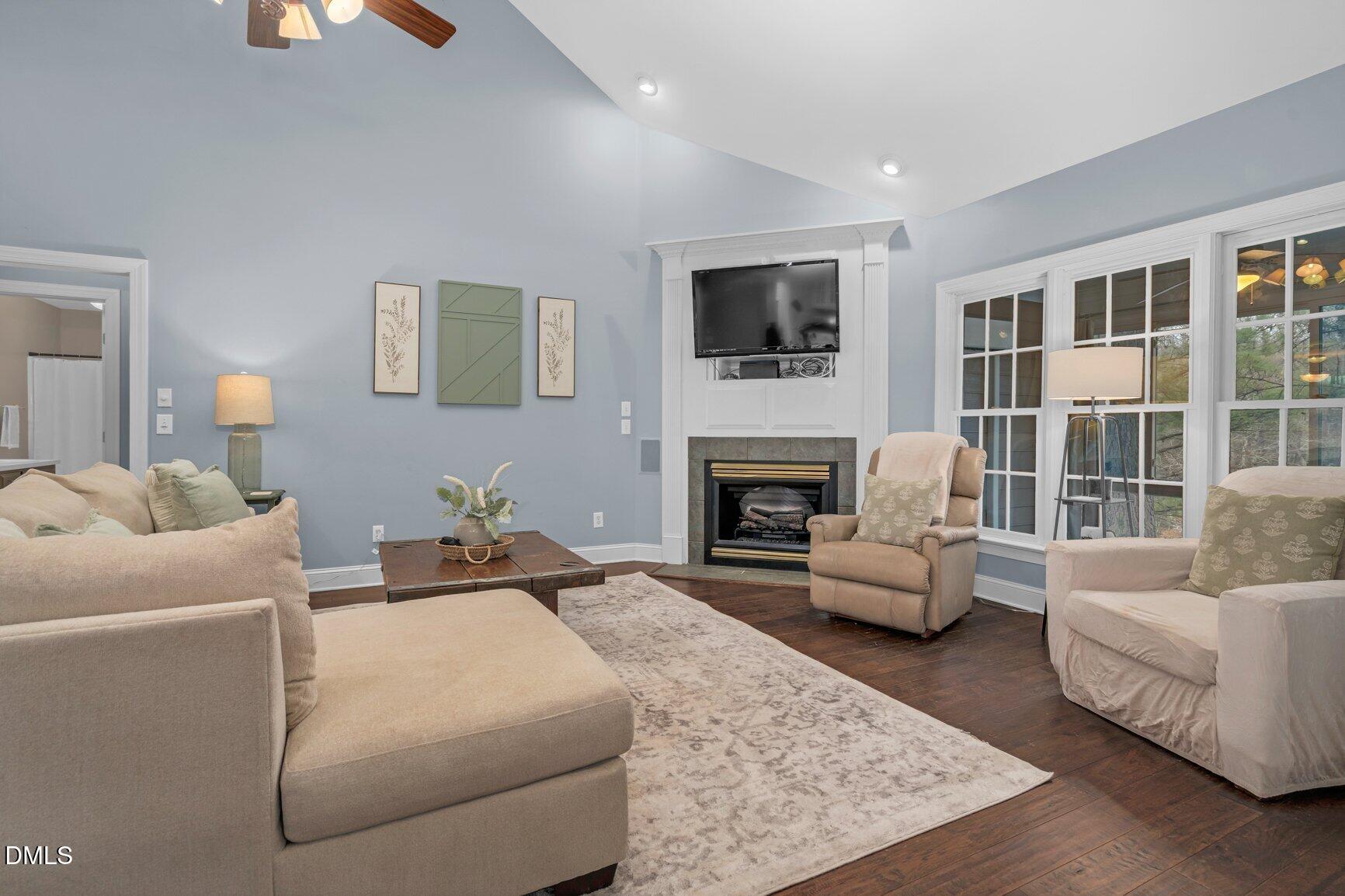 259 Sacred Fire Road Louisburg, NC 27549 - Photo 6 of 35 a living room with furniture and a fireplace