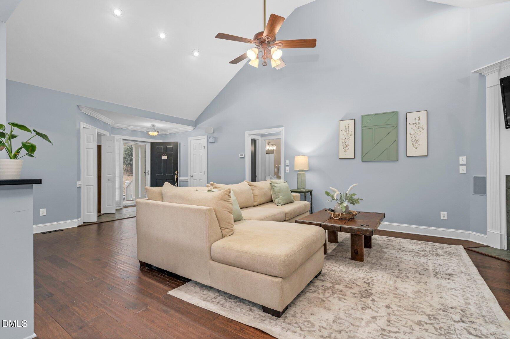 259 Sacred Fire Road Louisburg, NC 27549 - Photo 7 of 35 a living room with furniture and a rug