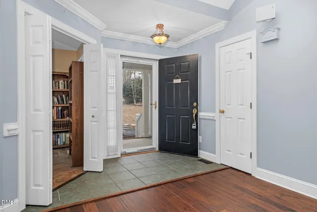 a view of a workspace with furniture and a cabinet
