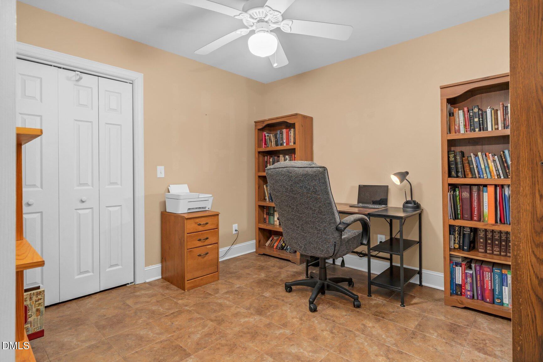 259 Sacred Fire Road Louisburg, NC 27549 - Photo 10 of 35 a view of a workspace with furniture and a cabinet