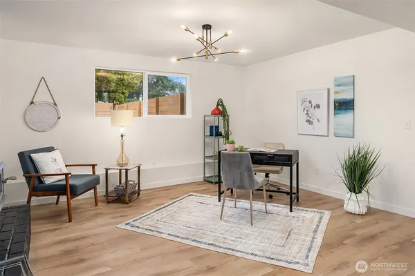 a workspace with furniture and a potted plant