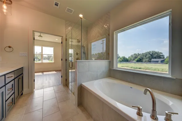 a bathroom with a bathtub and a shower