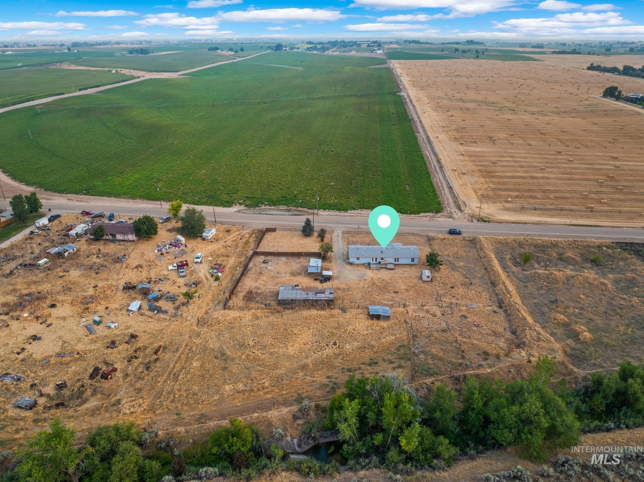 15190 Oasis Road Caldwell, ID 83607 - Photo 36 of 36 Single-story residence situated on a land parcel with surrounding agricultural fields