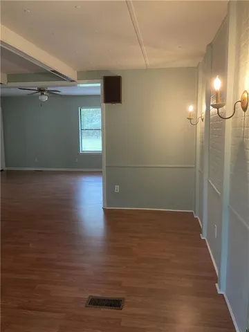 a view of a livingroom with wooden floor