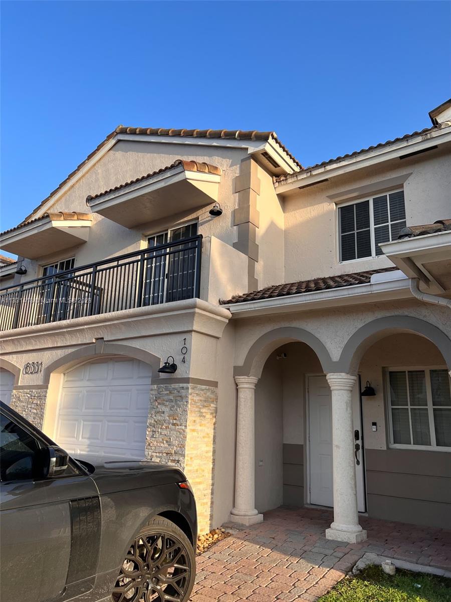 8331 Southwest 124th Avenue, Unit 10414 Miami, FL 33183 - Photo 2 of 12 a view of a house with a balcony