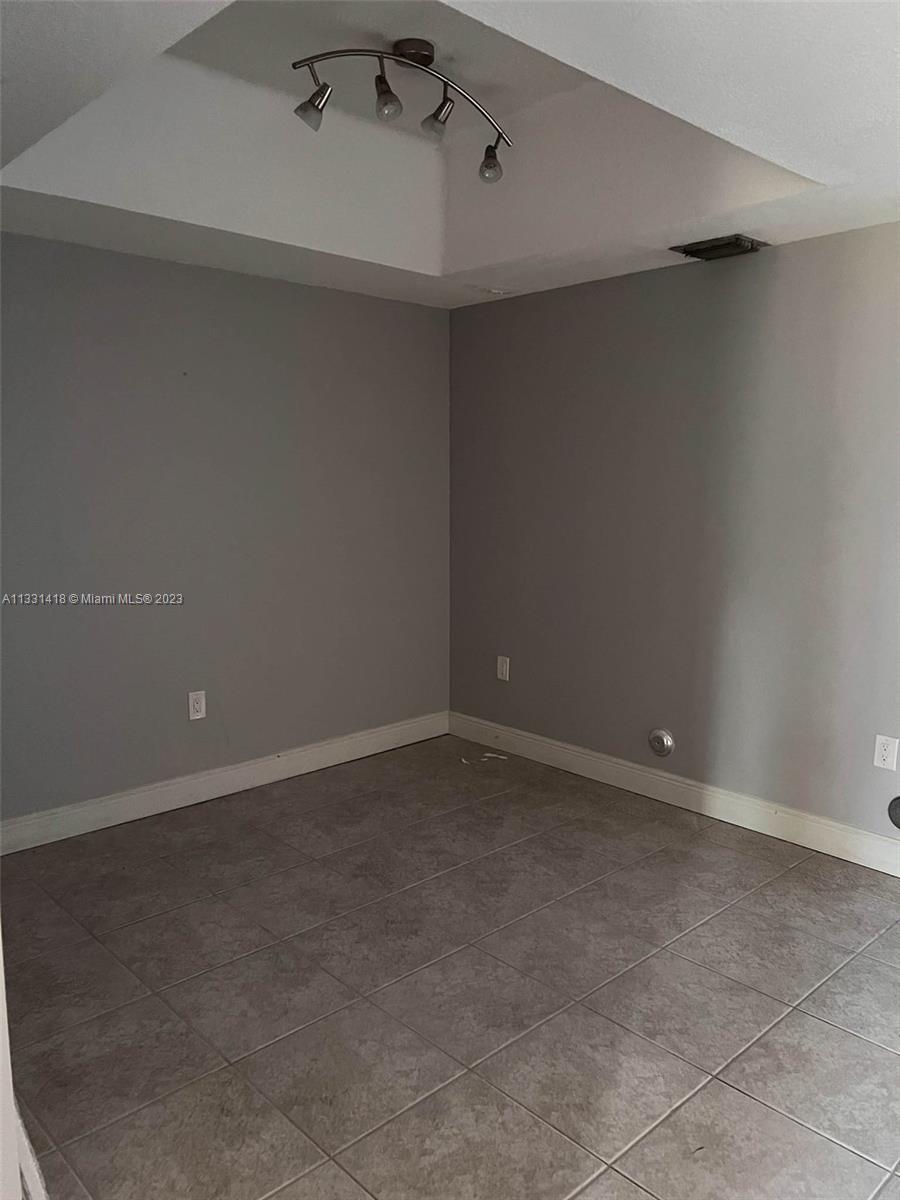 8331 Southwest 124th Avenue, Unit 10414 Miami, FL 33183 - Photo 4 of 12 a view of an empty room