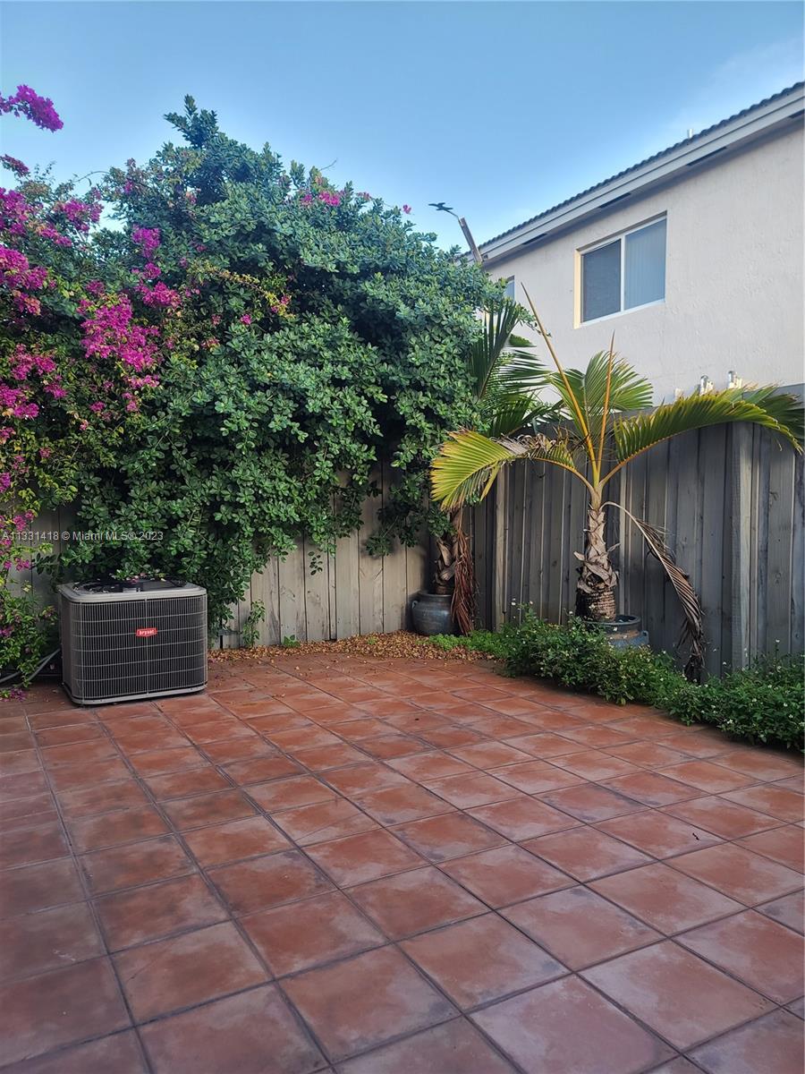 8331 Southwest 124th Avenue, Unit 10414 Miami, FL 33183 - Photo 9 of 12 a view of a house with a yard