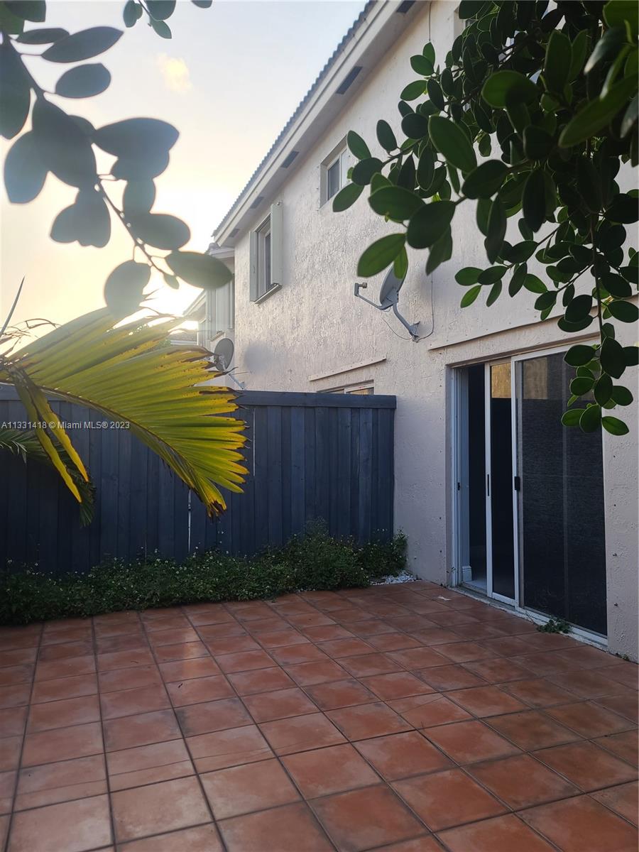 8331 Southwest 124th Avenue, Unit 10414 Miami, FL 33183 - Photo 10 of 12 a view of a house with a yard