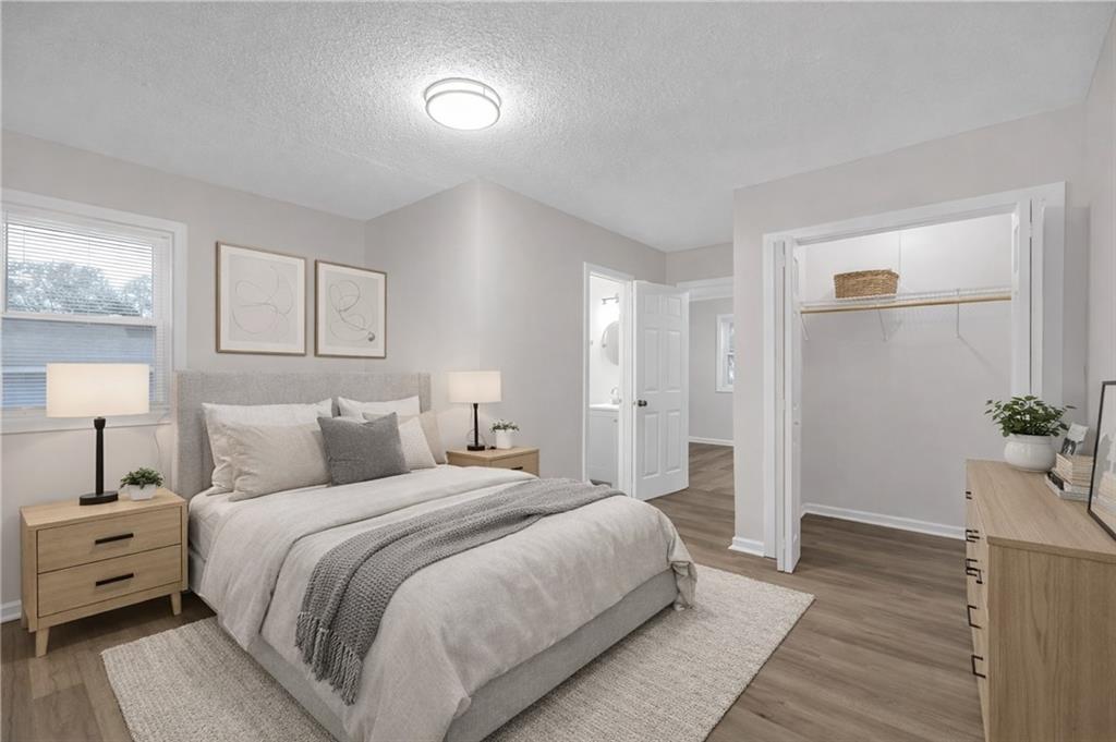 1683 Candler Road Decatur, GA 30032 - Photo 15 of 26 a bed room with a bed and a potted plant