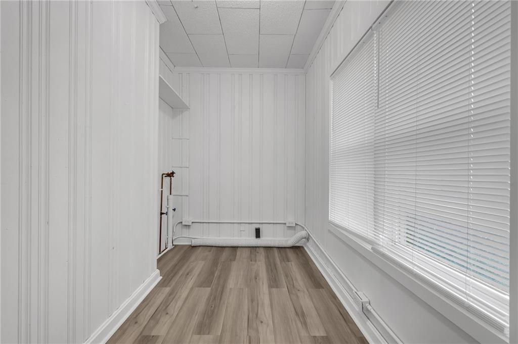 1683 Candler Road Decatur, GA 30032 - Photo 19 of 26 a view of a room with wooden floor and white door