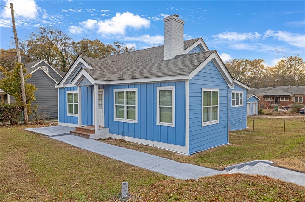 1683 Candler Road Decatur, GA 30032 - Photo 2 of 26 a front view of a house with a yard