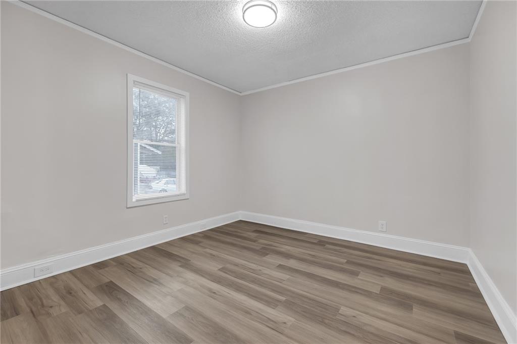 1683 Candler Road Decatur, GA 30032 - Photo 23 of 26 an empty room with windows