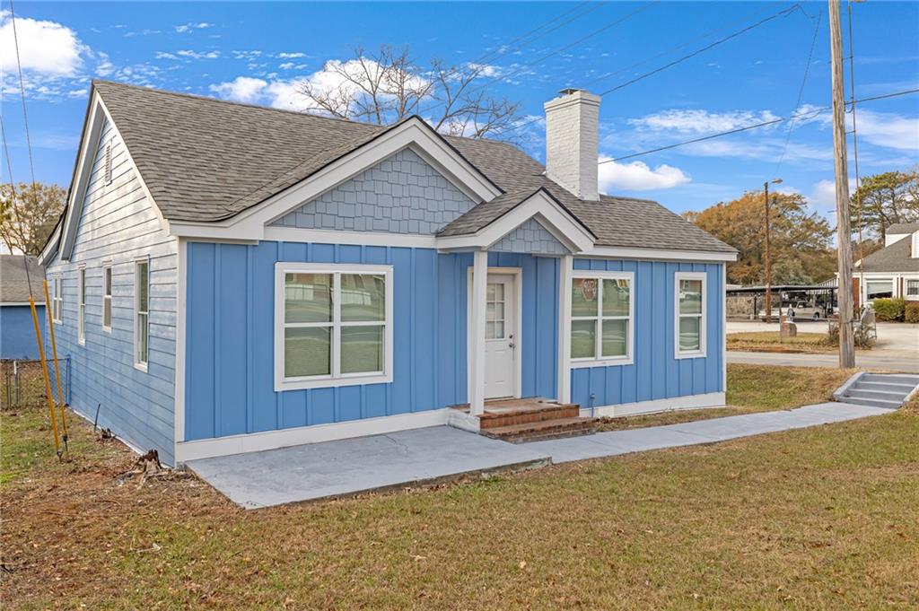 1683 Candler Road Decatur, GA 30032 - Photo 3 of 26 a front view of a house with a yard