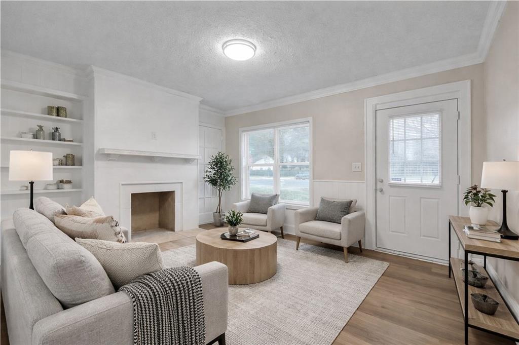 1683 Candler Road Decatur, GA 30032 - Photo 5 of 26 a living room with furniture and a fireplace