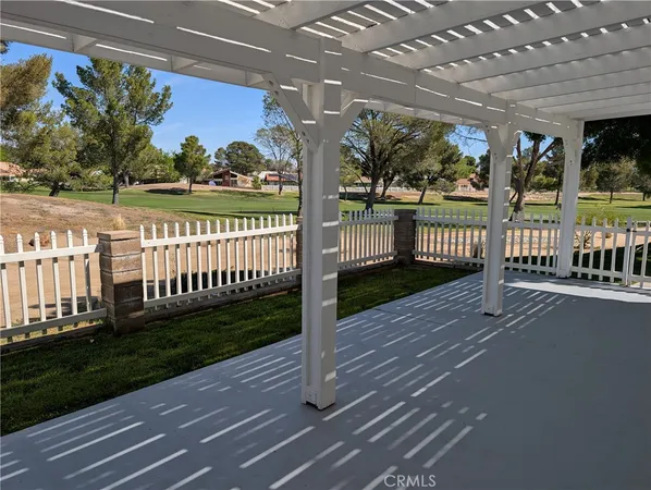 a view of porch with wooden floor