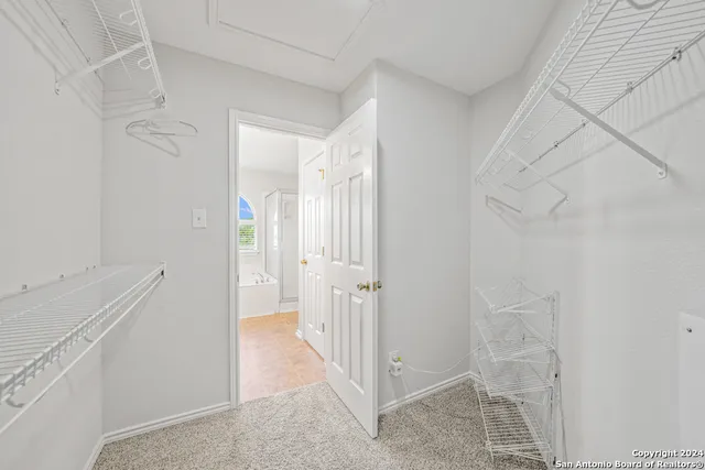 a view of a hallway with closet