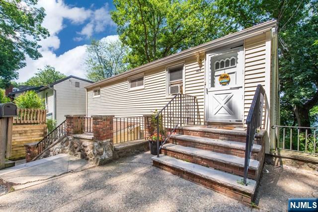 21 East Shore Road Denville, NJ 07834 - Photo 2 of 23 a view of a house with a small yard and wooden fence