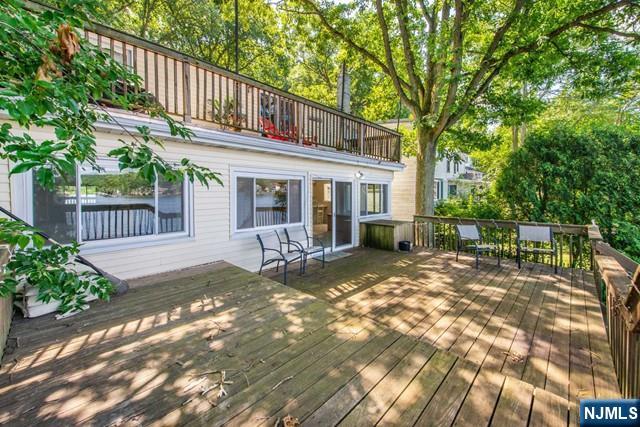 21 East Shore Road Denville, NJ 07834 - Photo 21 of 23 a view of a house with backyard and sitting area