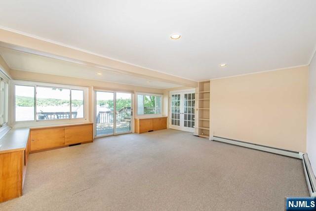 21 East Shore Road Denville, NJ 07834 - Photo 6 of 23 an empty room with wooden floor and a large window