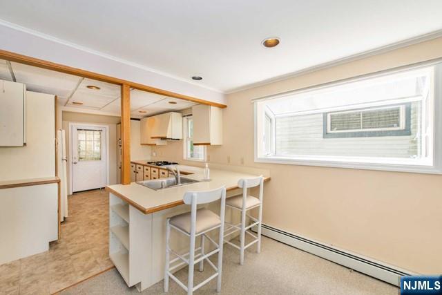 21 East Shore Road Denville, NJ 07834 - Photo 9 of 23 a kitchen with granite countertop cabinets and chair