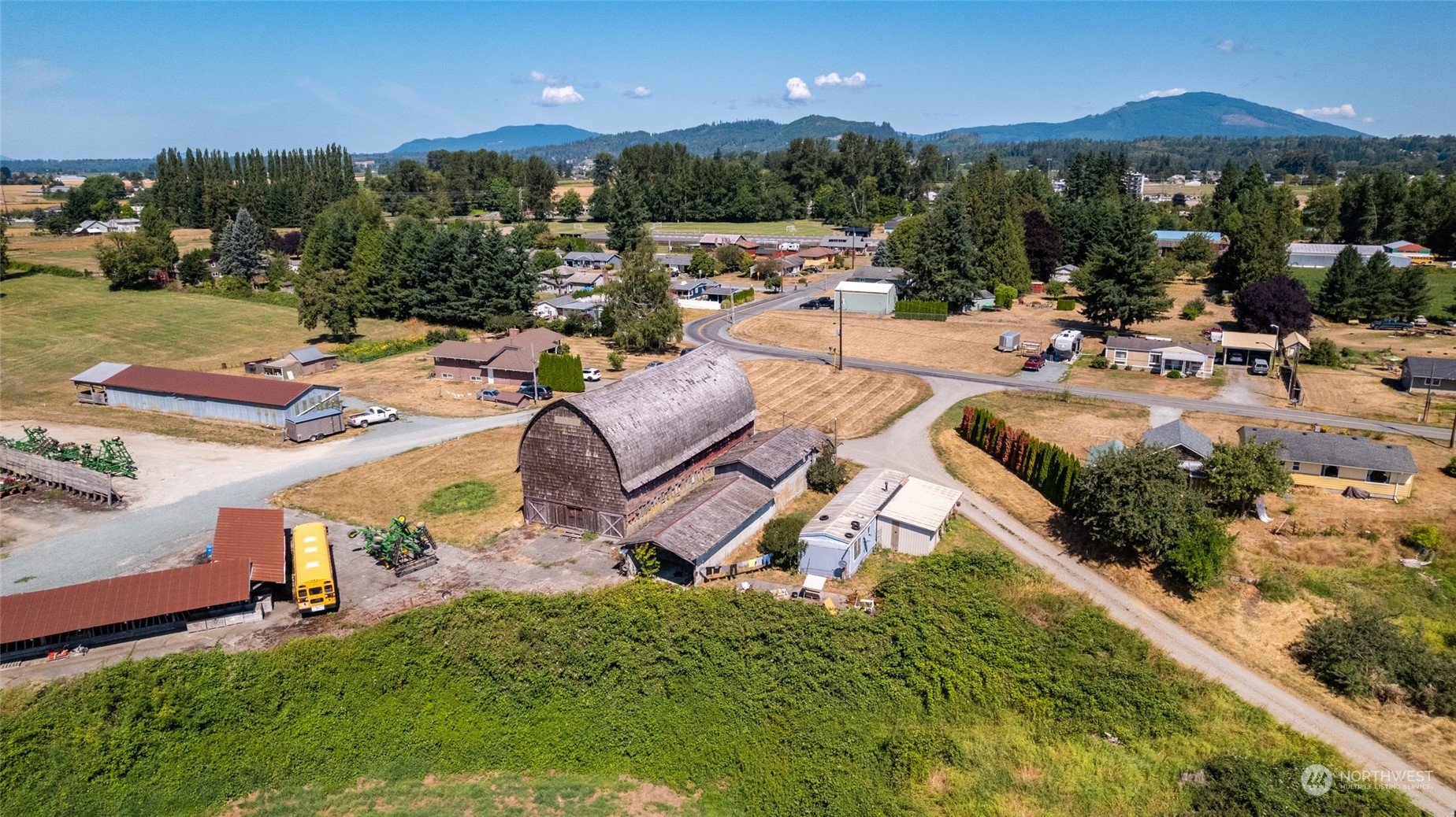 22648 Rhodes Road Sedro-Woolley, WA 98284 - Photo 13 of 13 an outdoor space with patio furniture and a garden