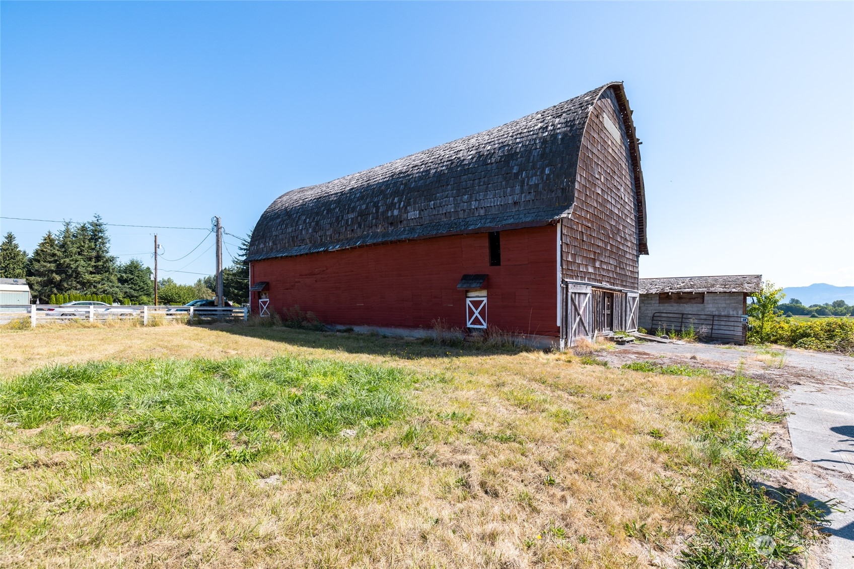 22648 Rhodes Road Sedro-Woolley, WA 98284 - Photo 2 of 13 a house with trees in the background