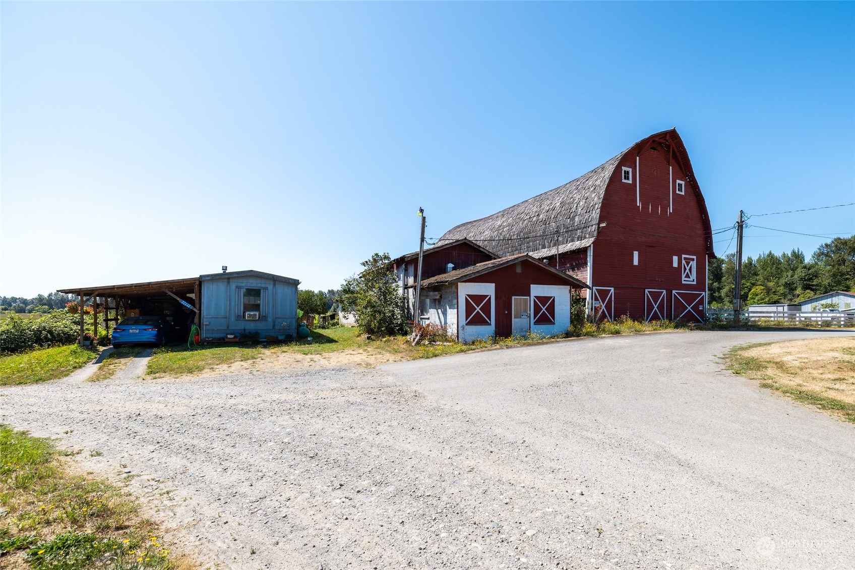 22648 Rhodes Road Sedro-Woolley, WA 98284 - Photo 4 of 13 a front view of a house with a yard