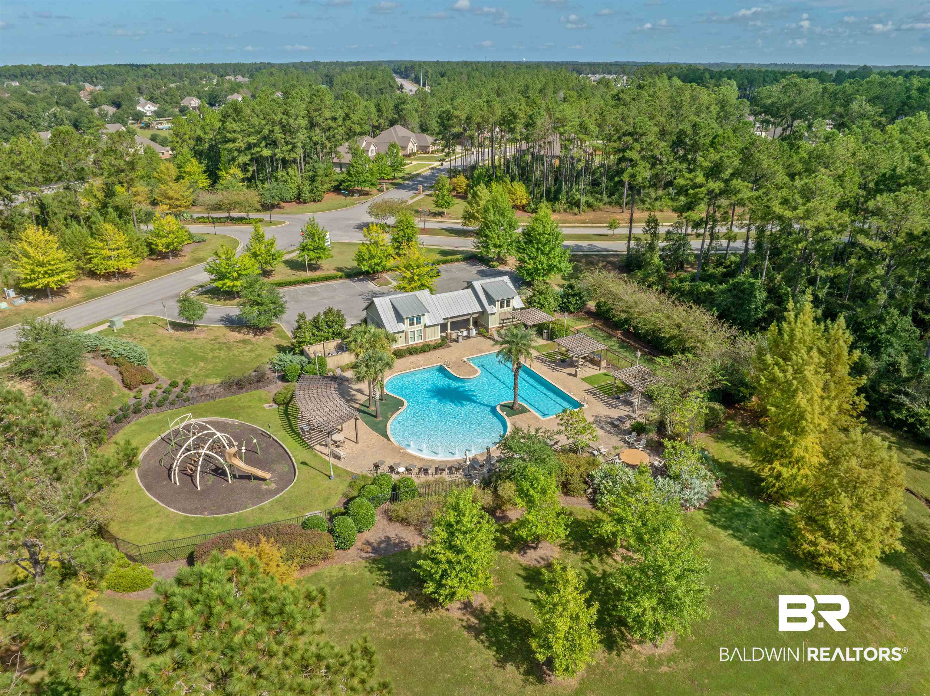12738 Chickadee Lane Daphne, AL 36527 - Photo 30 of 30 Drone / aerial view of a pool area and a heavily wooded area