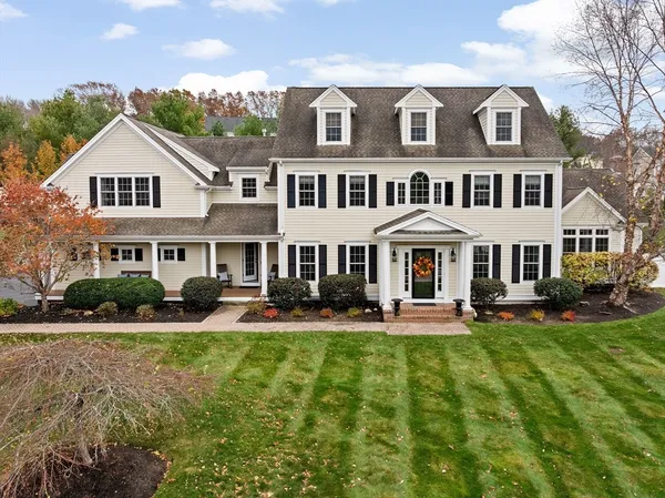 a front view of a house with a yard