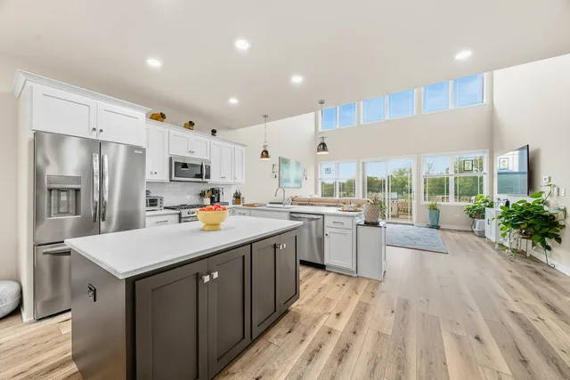 a kitchen with counter space sink appliances and cabinets