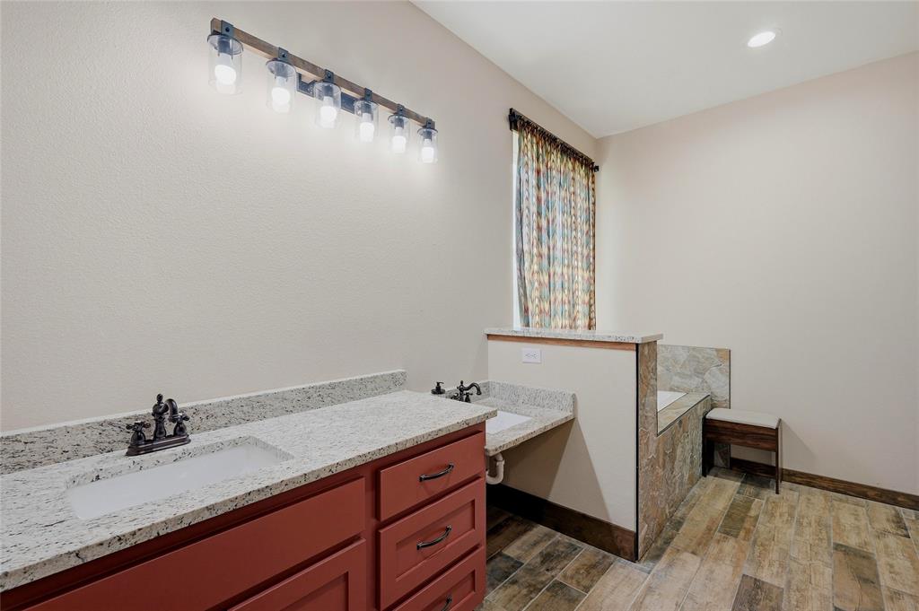 4652 Old Southmayd Road Sherman, TX 75092 - Photo 20 of 40 a bathroom with a sink and a mirror