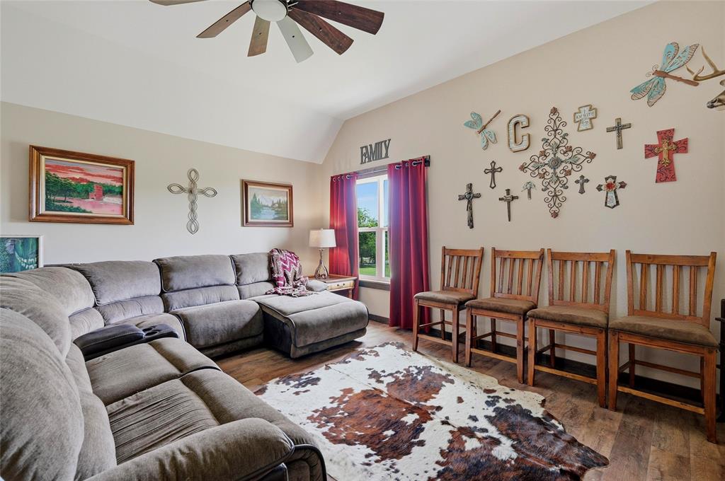 4652 Old Southmayd Road Sherman, TX 75092 - Photo 23 of 40 a living room with furniture and a rug
