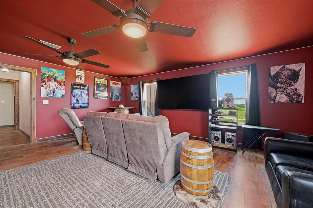 4652 Old Southmayd Road Sherman, TX 75092 - Photo 26 of 40 a dining room with furniture a rug and wooden floor