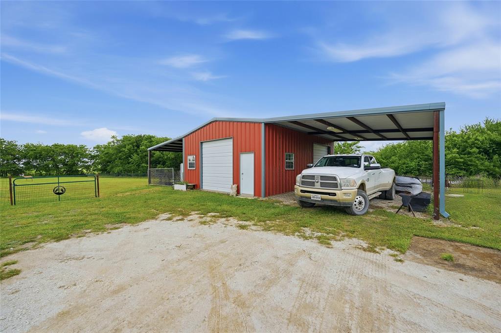 4652 Old Southmayd Road Sherman, TX 75092 - Photo 35 of 40 a car parked in front of a house with a big yard