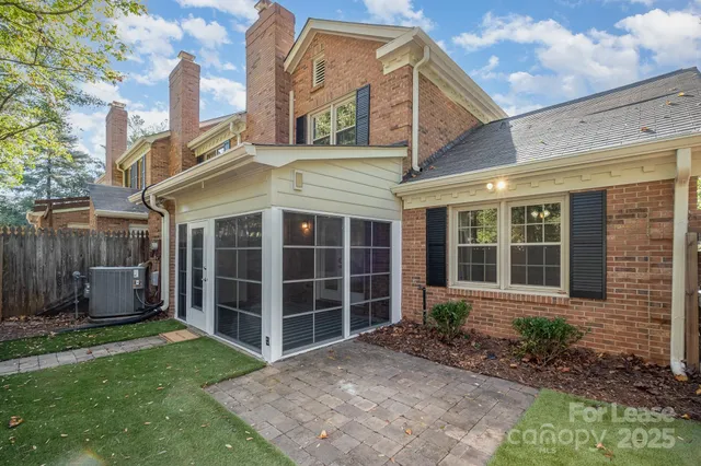a view of a brick house with a large windows