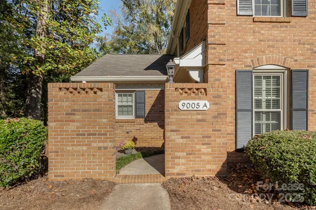 a brick building with a sign on it