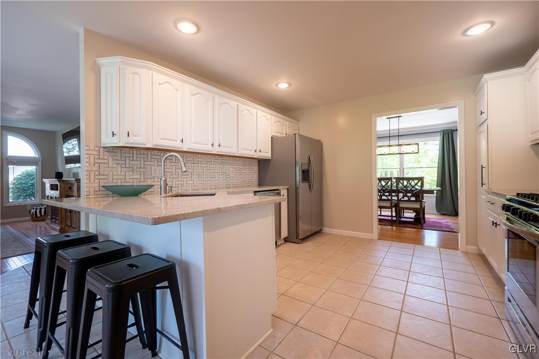 1640 Deer Path Road Easton, PA 18040 - Photo 11 of 39 a kitchen with a refrigerator a stove and a sink