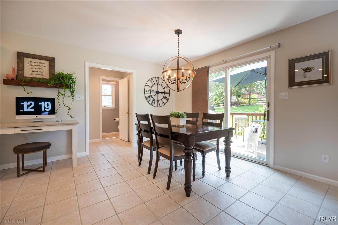 1640 Deer Path Road Easton, PA 18040 - Photo 12 of 39 a view of a dining room with furniture window and wooden floor