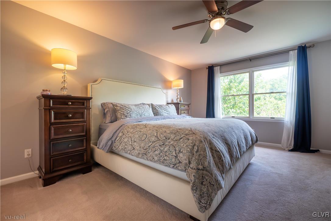 1640 Deer Path Road Easton, PA 18040 - Photo 21 of 39 a bedroom with a bed and a chandelier
