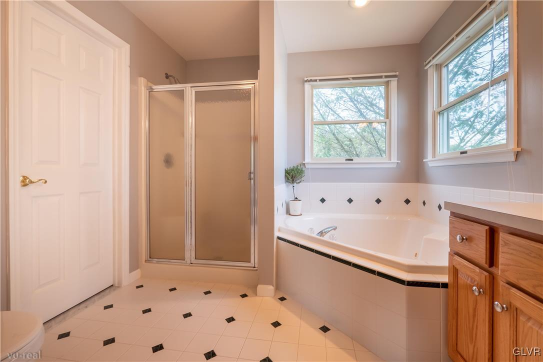 1640 Deer Path Road Easton, PA 18040 - Photo 23 of 39 a bathroom with a bathtub and a shower
