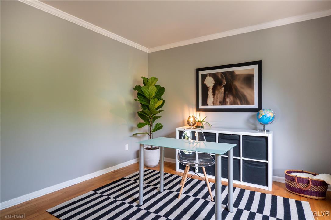 1640 Deer Path Road Easton, PA 18040 - Photo 5 of 39 a living room with furniture and a bookshelf