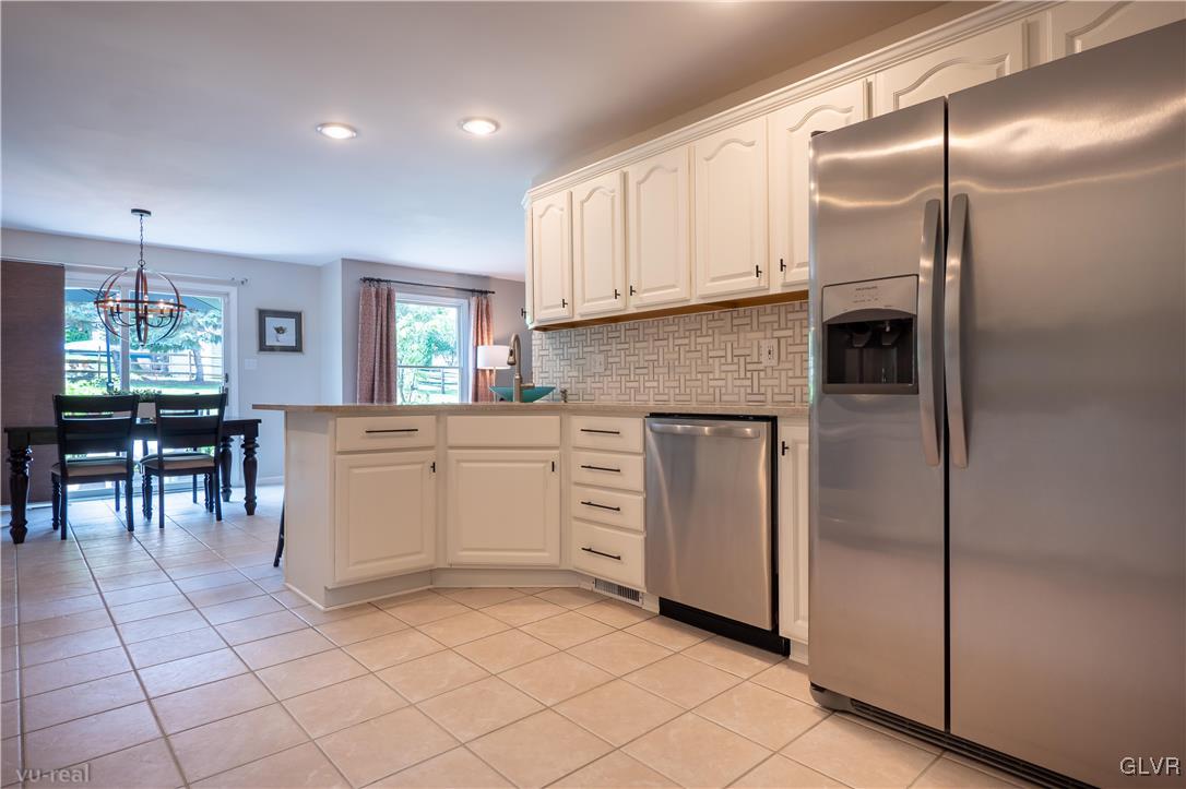 1640 Deer Path Road Easton, PA 18040 - Photo 8 of 39 a kitchen with white cabinets and white appliances