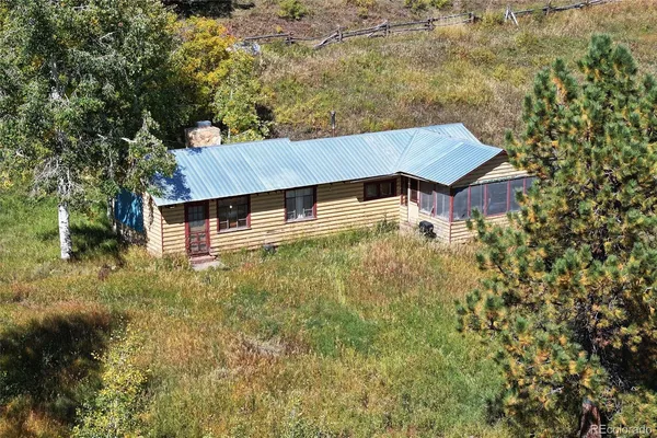 a aerial view of a house with a yard