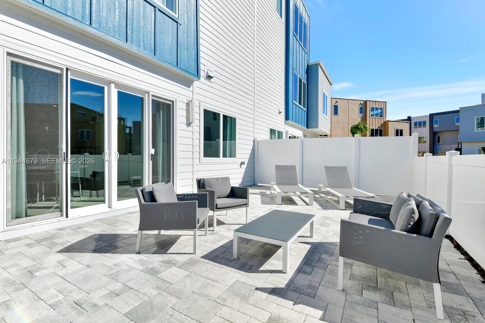 7740 Sandy Ridge Drive, Unit 136 Kissimmee, FL 34747 - Photo 22 of 26 a building outdoor space with patio furniture