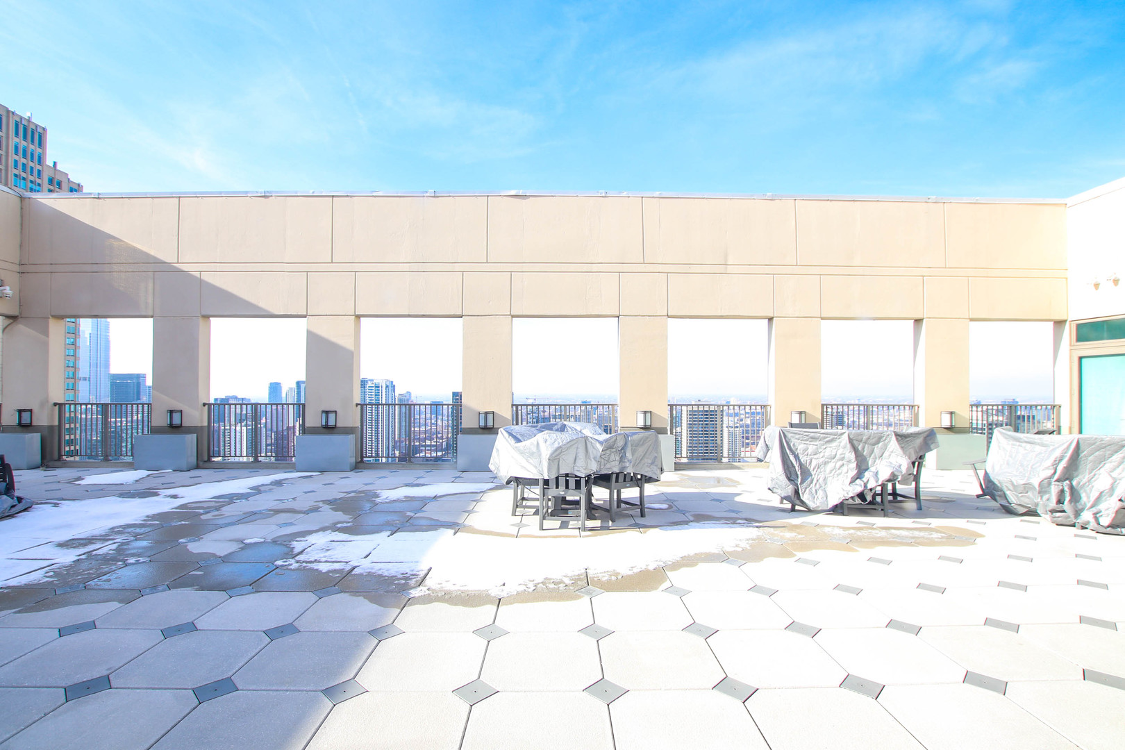 2 East Erie Street, Unit 2101 Chicago, IL 60611 - Photo 15 of 19 a view of a patio with a table and chairs