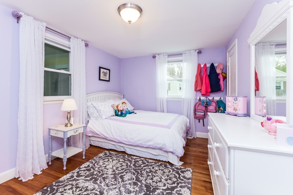 18 Mountain Road Waltham, MA 02451 - Photo 14 of 22 a bedroom with a bed and a window